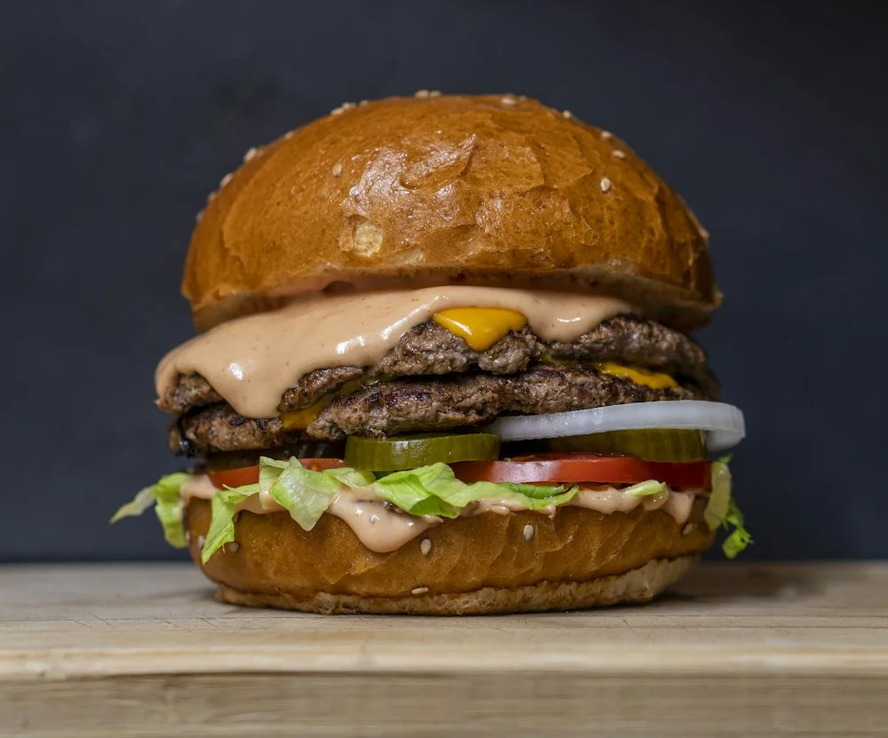 A juicy burger with a toasted bun